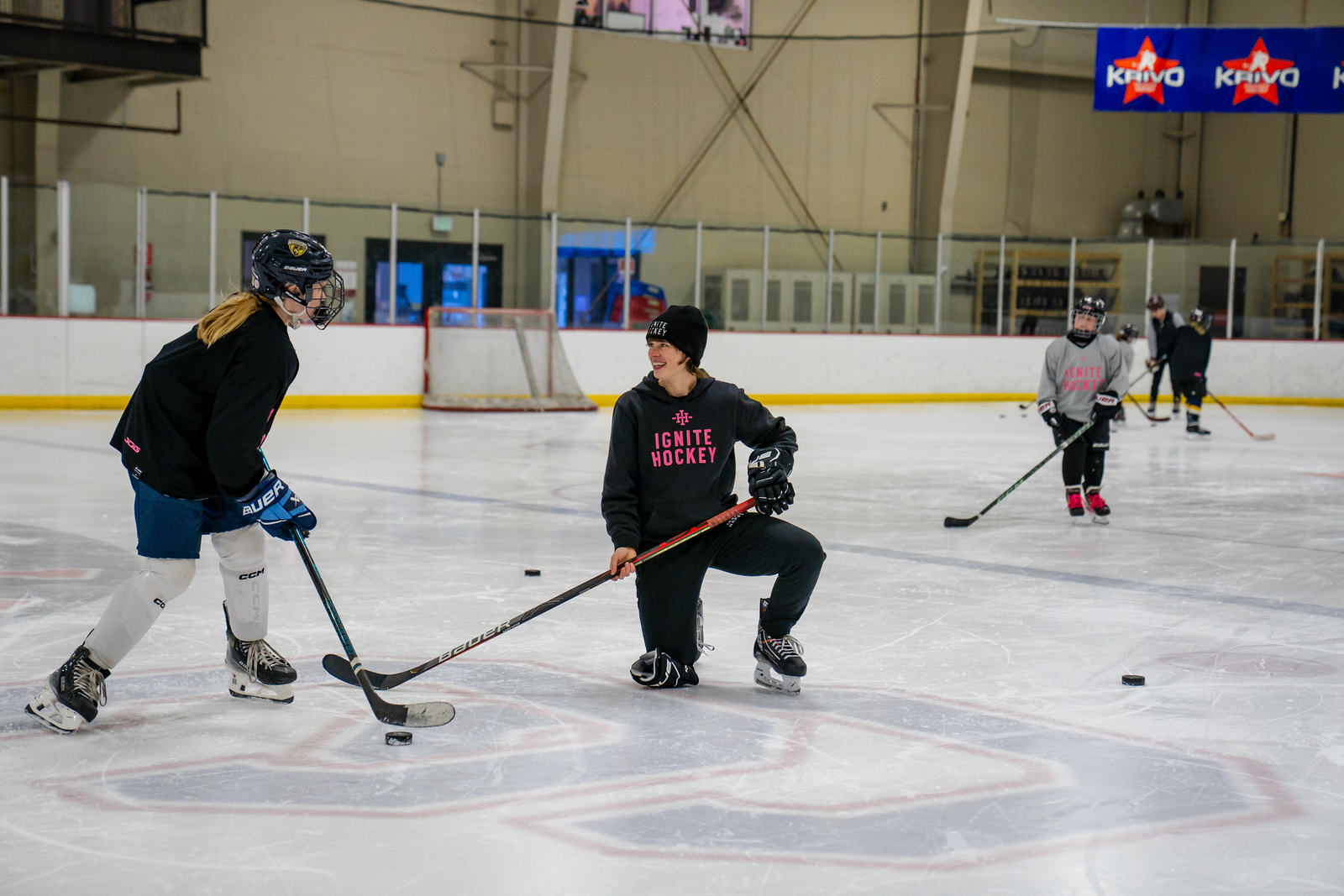 Julia Tylke coaching on the ice with Ignite Hockey